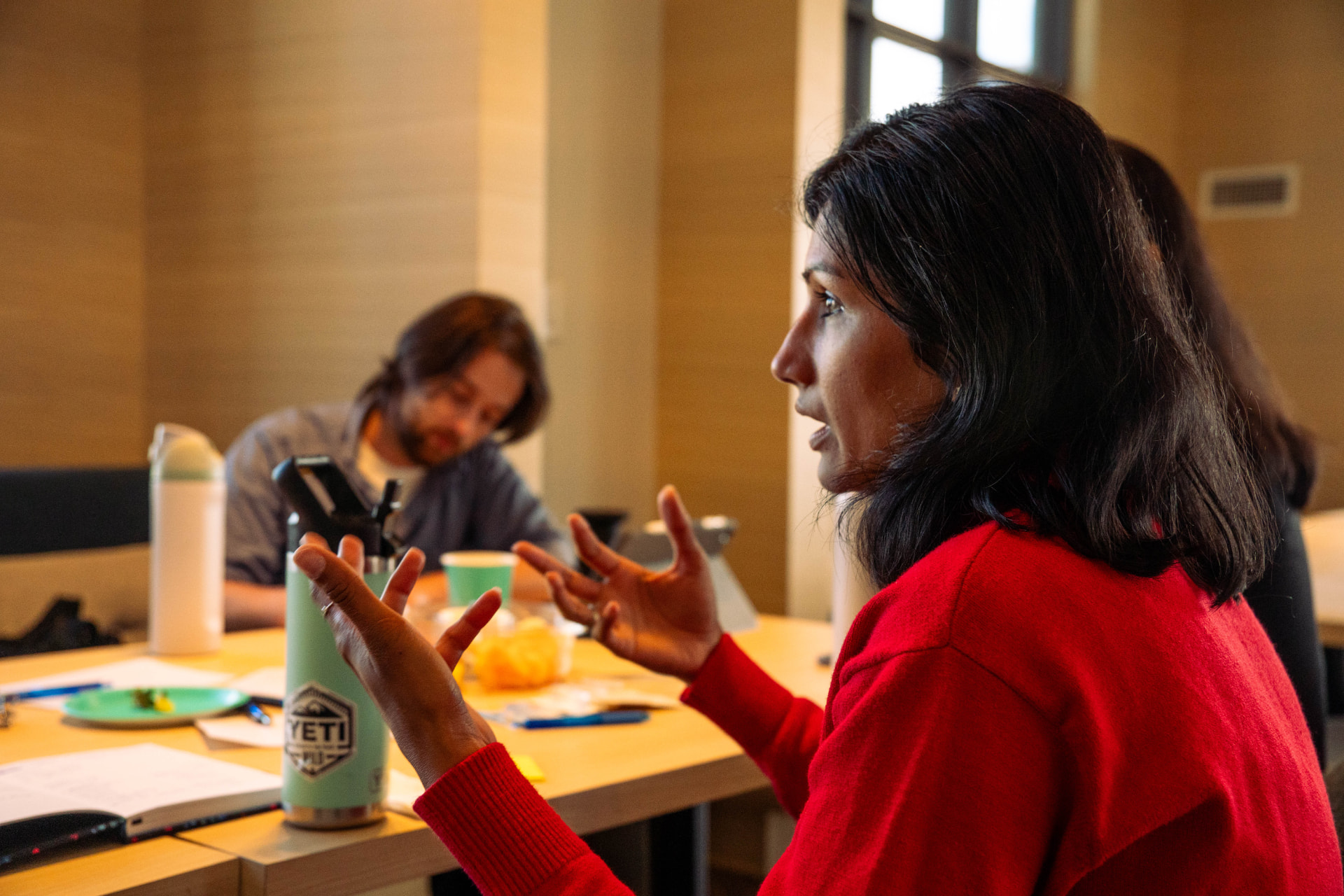 Attendee contributing to a small-group wildfire discussion