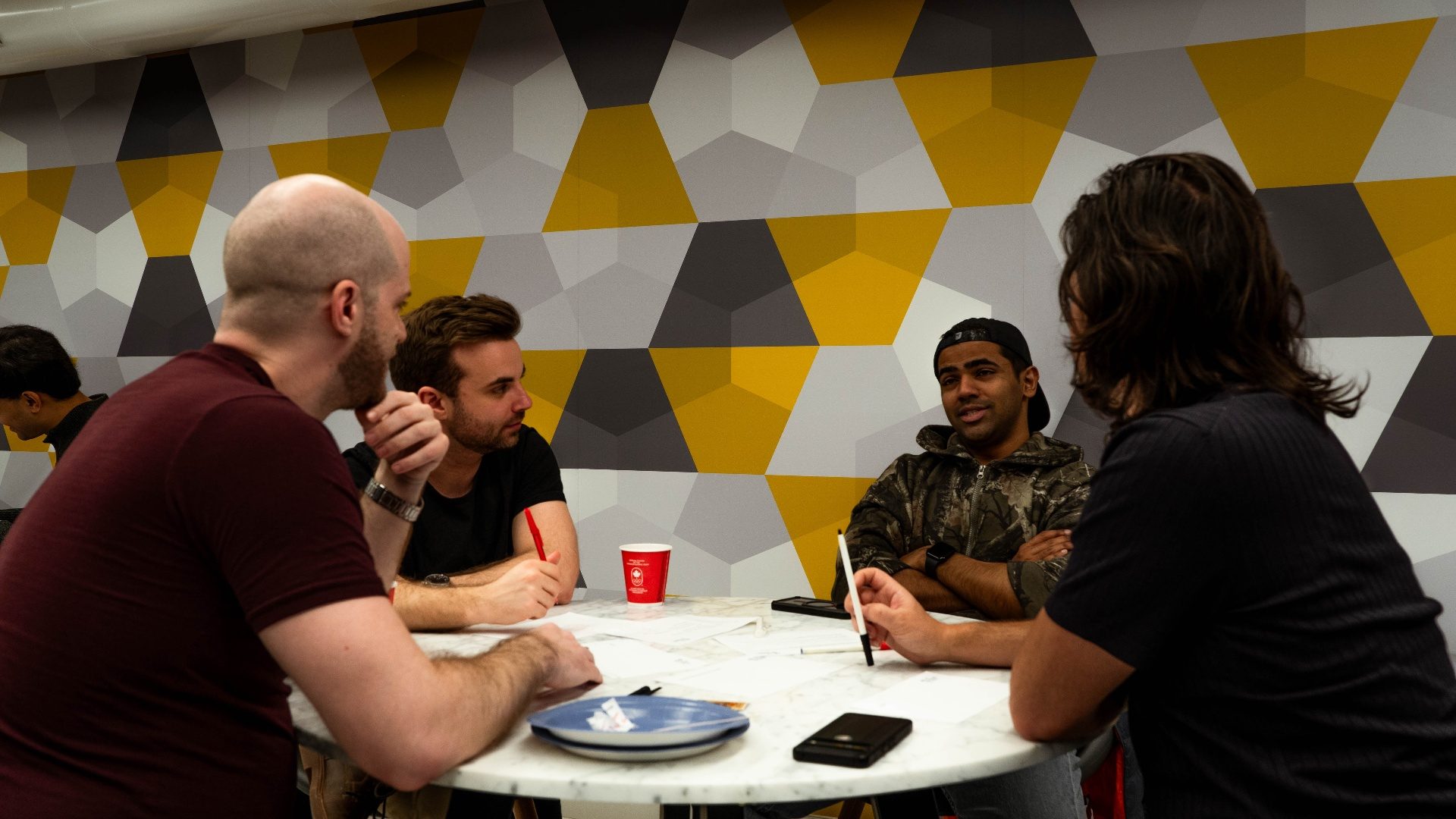 Attendees in a group discussion at a Modern Agora event
